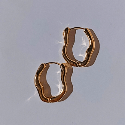 Imagen de Pendientes de aro Irregulares en oro y acero inox